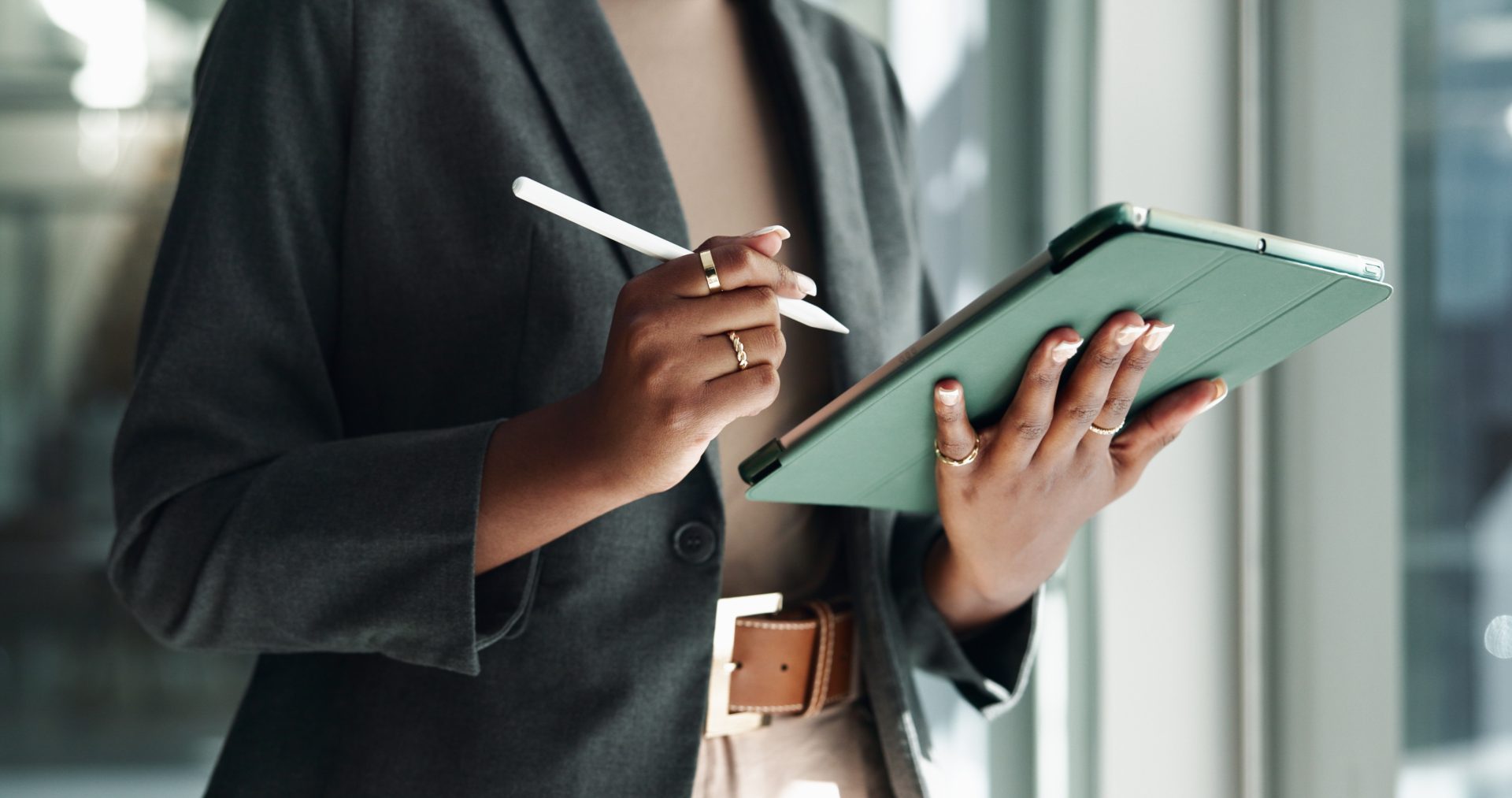 Professional holding a tablet and stylus